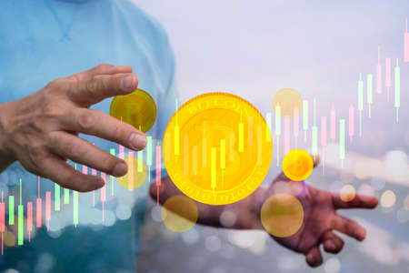 Businessman with hands offers bitcoin concept design. Bitcoin coins with graph for shown Finance and...