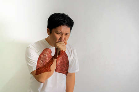 Asian man is ill Sick cough due to the common cold, allergies, allergies, bad air, dust, tuberculosis Air pollution, emphysema concepts. Double Exposure with lungs, Virus infectionの写真素材