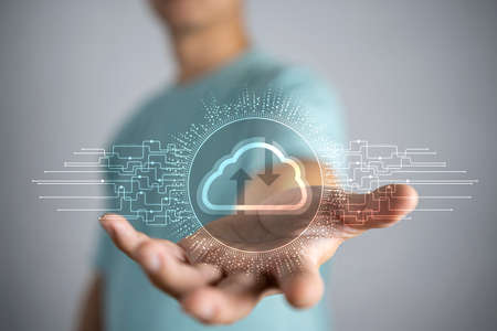 Businessman hold cloud icon.Cloud computing concept - connect smart phone to cloud. computing network information technologist with smart phone.Big data Conceptの写真素材