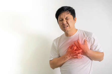 Man having a heart attack. 40-year-old man suffering from heart diseaseの写真素材