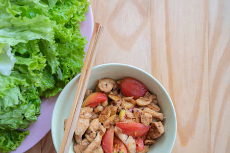 Grilled chicken breast. Fried chicken fillet and fresh vegetable salad of tomatoes, cucumbers and arugula leaves. Chicken meat salad. Healthy food. Flat lay. Top view. White backgroundの写真素材