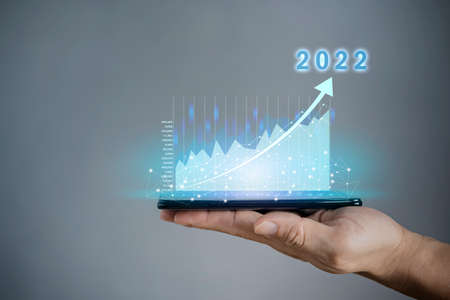 2022 business finance technology and investment concept. Stock Market Investments Funds and Digital Assets. businessman analysing forex trading graph financial data. Business finance background.の写真素材