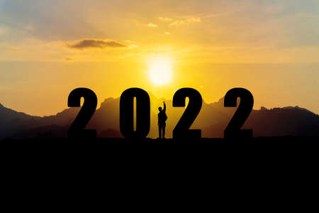 New year concept of 2022. New year's card. Businessman raising his fist showing joy, celebrate during the festivalの写真素材