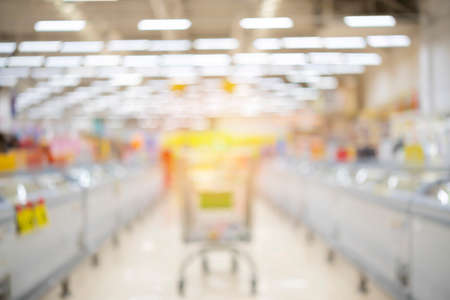 Abstract blurred supermarket aisle and shelves background, supermarket cartの写真素材
