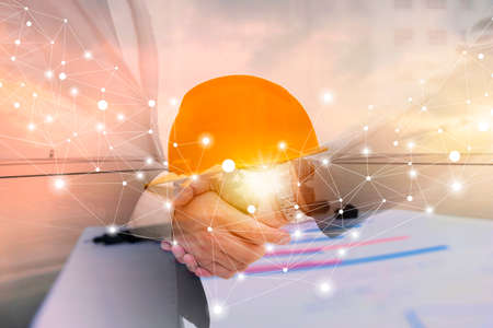 Businessmen are shaking hands for business venture and Marketing on energy. Solar is needed in the future.Solar panels require expertise in installation.photovoltaics to the business sector.の写真素材