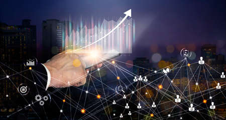 Double exposure of businessman using laptop computer and the city with global networking, data exchanges, innovative futuristicd technology icons, modern tech icons, Global businessの写真素材