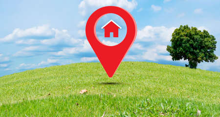 House symbol with pin icon on earth and green grass in real estate sale or real estate investment ideas. Buying a new home for the family - 3D large billboard illustrationの写真素材