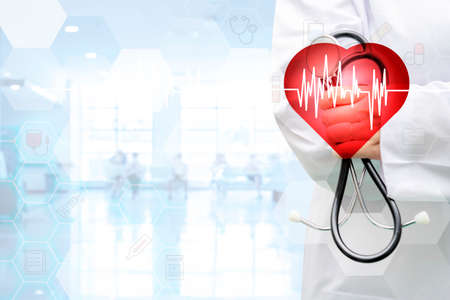 Doctor with stethoscope and white icon medical on hospital background, medical technology network conceptの写真素材