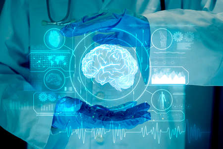 Doctor shows the brain of a person on a blue background., analysis with modern virtual interface in laboratory, innovative technology in science and medicine conceptの写真素材