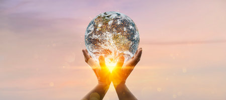 Earth at night was holding in human hands. Earth day. Energy saving concept,の写真素材