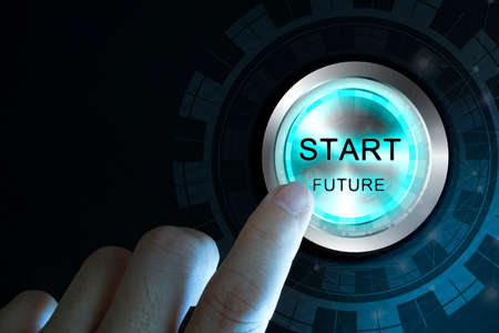 Businessman press start future button with virtual light in dark backgroundの写真素材