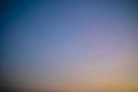 Abstract nature background of romantic pastel sky with silky & wispy cloud in golden hour time at spring evening. Beautiful puffy & fluffy clouds in bright blue sky in morning sunlight, copy spaceの写真素材