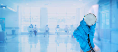 Doctor with a stethoscope in the hands.Healthcare and medical concept. Medicine doctor with stethoscope in hand and Patients come to the hospital background.の写真素材