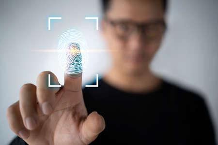 Fingerprint scan provides security access with biometrics identification. Business Technology Safety Internet Network Conceptの写真素材