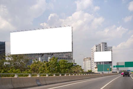Large horizontal blank sign on a highway in Bangkok, Thailand. Traffic and sky.の写真素材