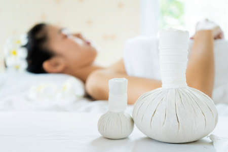 Thai massage. Woman receiving back massage, relaxing in spa and enjoying aroma therapyの写真素材