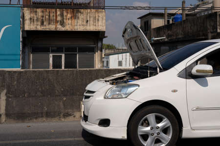 There was a car accident on the road, damaged cars in the city causing engine damage.の写真素材