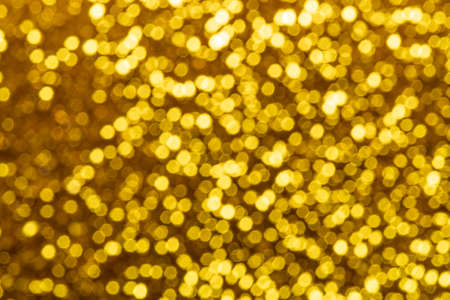 gold abstract background with bokeh defocused lights