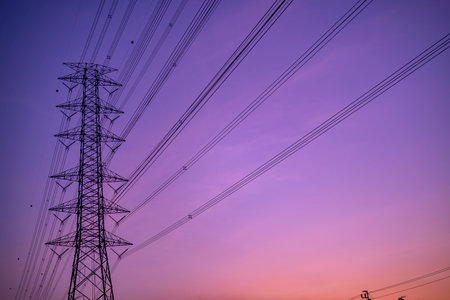high voltage post.High-voltage tower sky background. Electricity concept, Close up high voltage power lines station. High voltage electric transmission pylon silhouetted tower.の写真素材