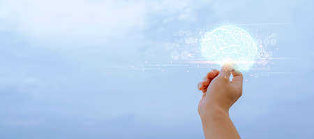 Abstract palm hands touching brain with network connections, innovative technology in science and communication conceptの写真素材