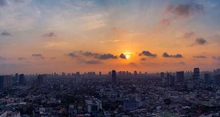 sunset rooftop view bangkok city office buildings tower, hotel and living, condominium in bangkok city skyline top view Downtown and business office bank financial in capital city of thailand asianの写真素材