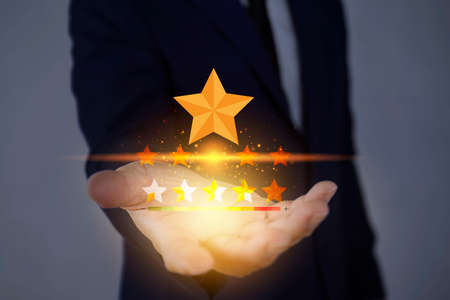 Customer Experience Concept, Best Excellent Services for Satisfaction present by Opened Hand of Client giving a Five Star Ratingの写真素材