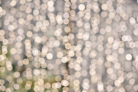 silver bokeh backgounds Abstract. Festive defocused lights.の写真素材