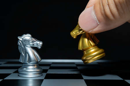 Plan leading strategy of successful business competition leader concept, Hand of player chess board game putting black pawn, Copy space for your textの写真素材