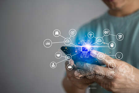 Mobile banking network, online payment, digital marketing. Business people using mobile phone with credit card and icon network connection on dark blue virtual screen background, business technologyの写真素材