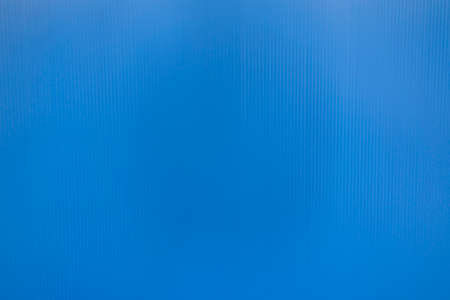 Corrugated plastic sheet or PP Flute Board (polypropylene board). Blue background with stripe effect.の写真素材