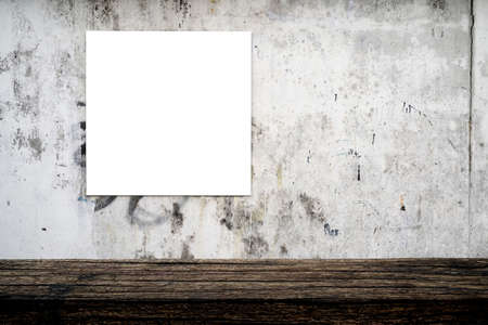 Empty brown wooden plank shelf at grunge concrete wall with menu item sign. A mockup for displaying or editing a product or design.の写真素材