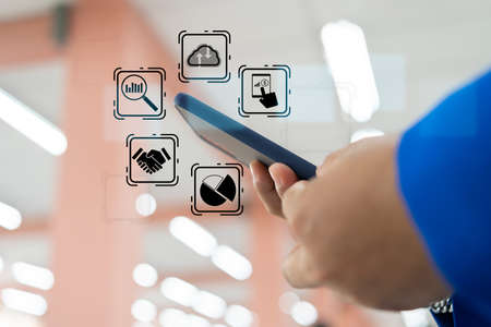 Office man using smartphone, double exposure office interior with skyscrapers, hologram of network icons, digital security interface, worldwide connection. Concept of personal data protectionの写真素材