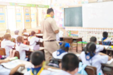 Blur kids and teacher in the classroom for background usage.の写真素材