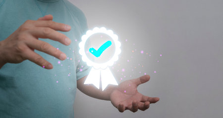 Hand shows the sign of the top service Quality assurance, Guarantee, Standards, ISO certification...