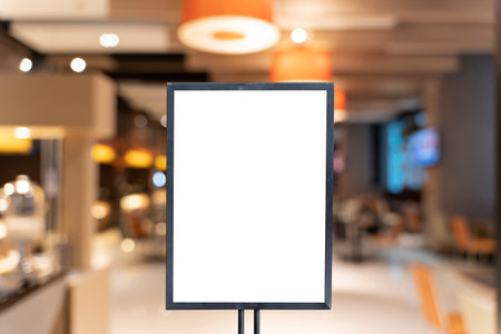 Mock up poster frame template in cafe table and seats interior advertising banner. Vertical empty advertising poster mock-up at the entrance of restaurantの写真素材