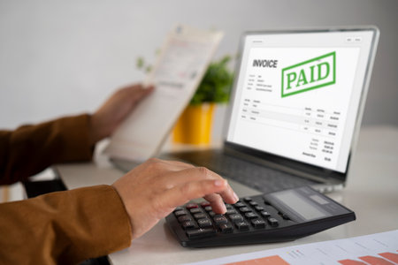 Online Digital Invoice And Tax Pay On Screen. Accountant Women At Desk Using Calculator For Accounting. Professional Accountant Man Doing Taxation And Business Auditの写真素材