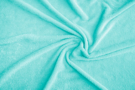Top view of green microfiber towel for fitness, yoga, gym, etc. Sport accessory. Close - up Clean white towel texture and seamless backgroundの写真素材
