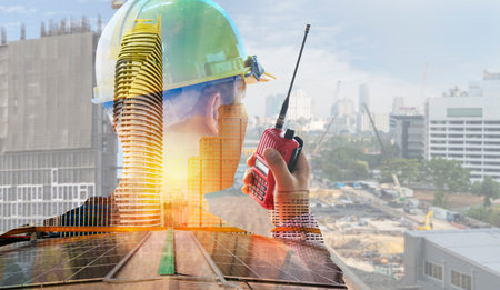 Engineer with safety helmet on solar energy background. Business about Natural energy concept. Double exposure, solar panels renewable energy and ecologyの写真素材