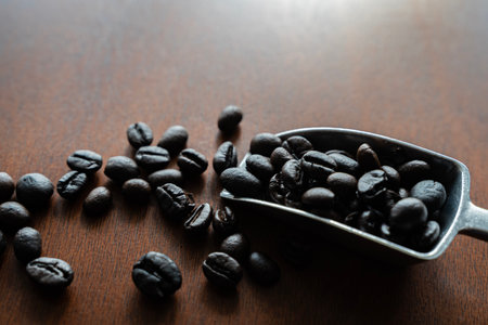 Closeup of coffee beans background.coffee beans on wooden table. Background of ground coffee...