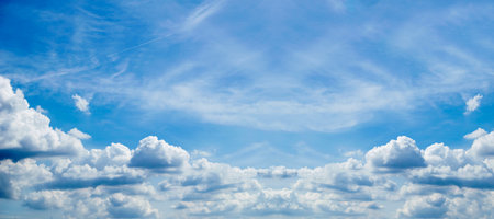 blue sky background with small clouds panorama. Cloudscape. Blue Sky and White Clouds Wide Panorama.