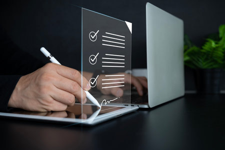 Electronic signature and paperless office concept. A businessman uses a pen to sign electronic documents on digital documents on a virtual screen. E-signing. Technology and document managementの写真素材