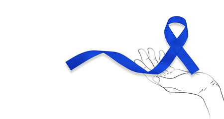 March Colorectal Cancer Awareness month. Cropped shot of man holding dark Blue Ribbon for supporting people living and illness. Healthcare, hope and World cancer day conceptの写真素材