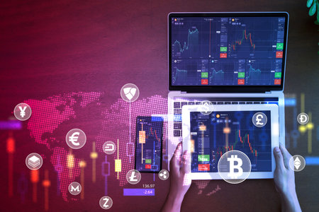 Businessman using online gadgets to invest in futuristic stock market. Crypto currency coin. International stock exchange. Charts, figures and sell and buy options.の写真素材