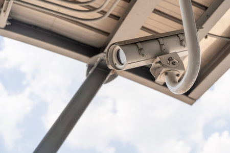 IP CCTV camera install by have water proof cover to protect camera with home security system concept with blur background. CCTV cameras are installed on the streets around Bangkok to monitor traffic.の写真素材
