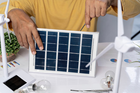 Professional solar planning blueprint with wind turbine team and solar power engineer ideas....