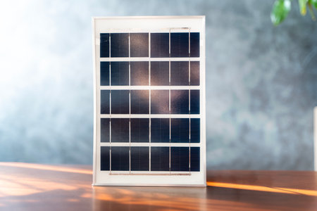 Solar panel, showing its photovoltaic cells is connected, which is storing the energy generated by the panel. The solar panel is in a sunny location, which is ideal for generating electricity.の写真素材
