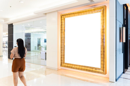 Mock up blank large billboard with clipping path on glassy showcase window in shopping mall...