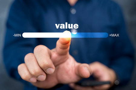 Businessman touching progress bar of business growth value, increase value, value added and business growth concept.の写真素材