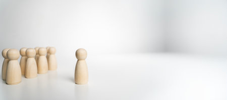 Teamwork concept, wooden dolls and wooden blocks show leadership. Work together for goals for the future.の写真素材