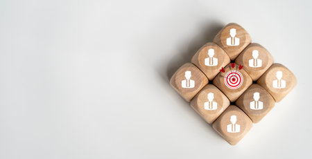 Target board and arrow which print screen to wooden cube block. Business achievement goal and objective target concept.の写真素材